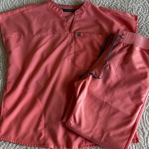 Fabletics scrubs size small (pants are small short). Color is coral.